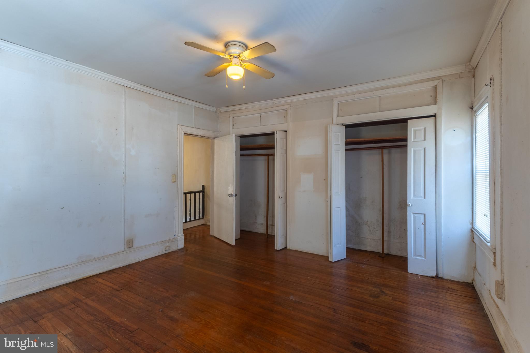 5911 Crown Street Capitol Heights, MD 20743 - Photo 17 of 28 an empty room with wooden floor and chandelier fan