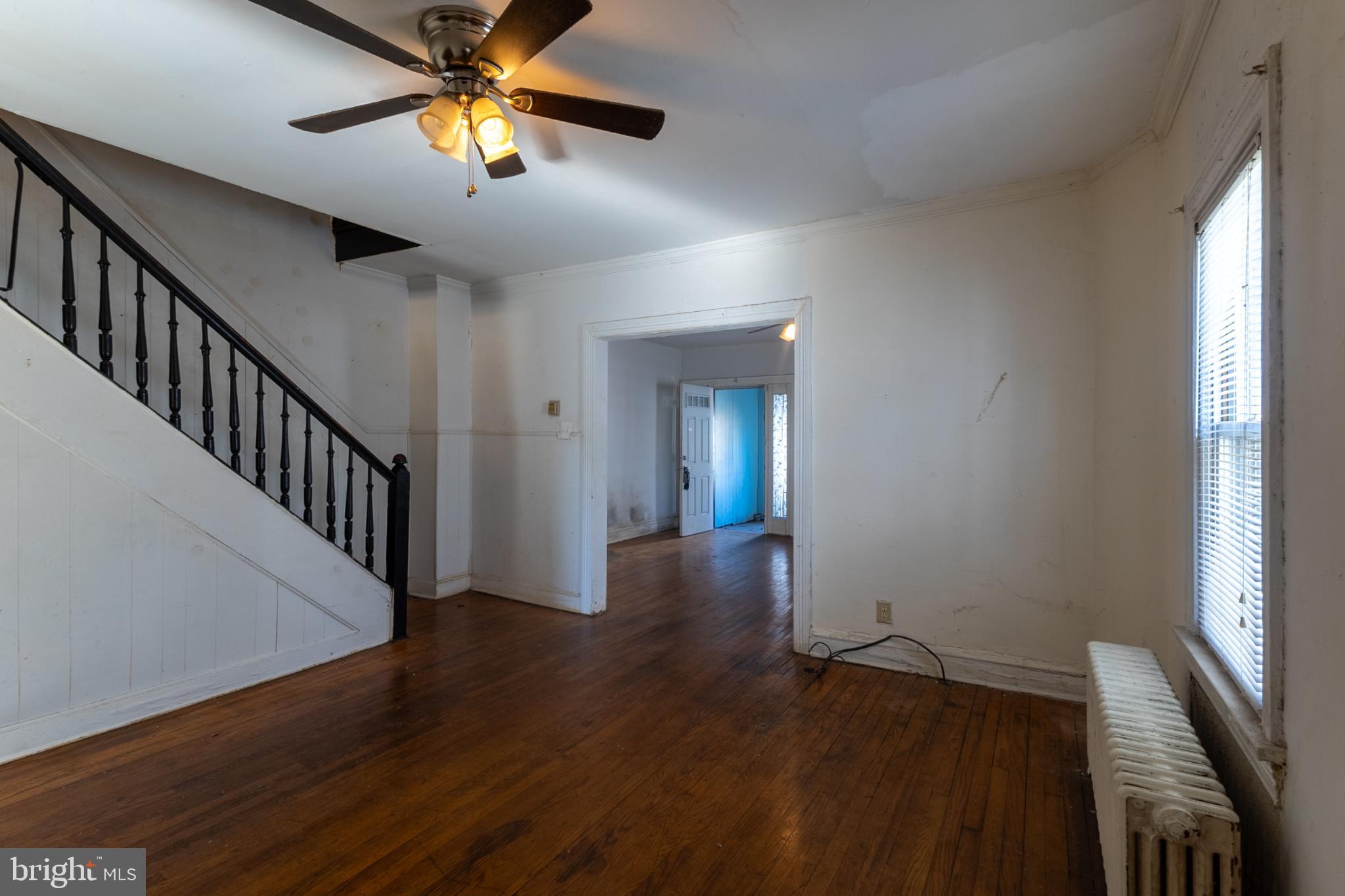 5911 Crown Street Capitol Heights, MD 20743 - Photo 6 of 28 a view of empty room with wooden floor and fan