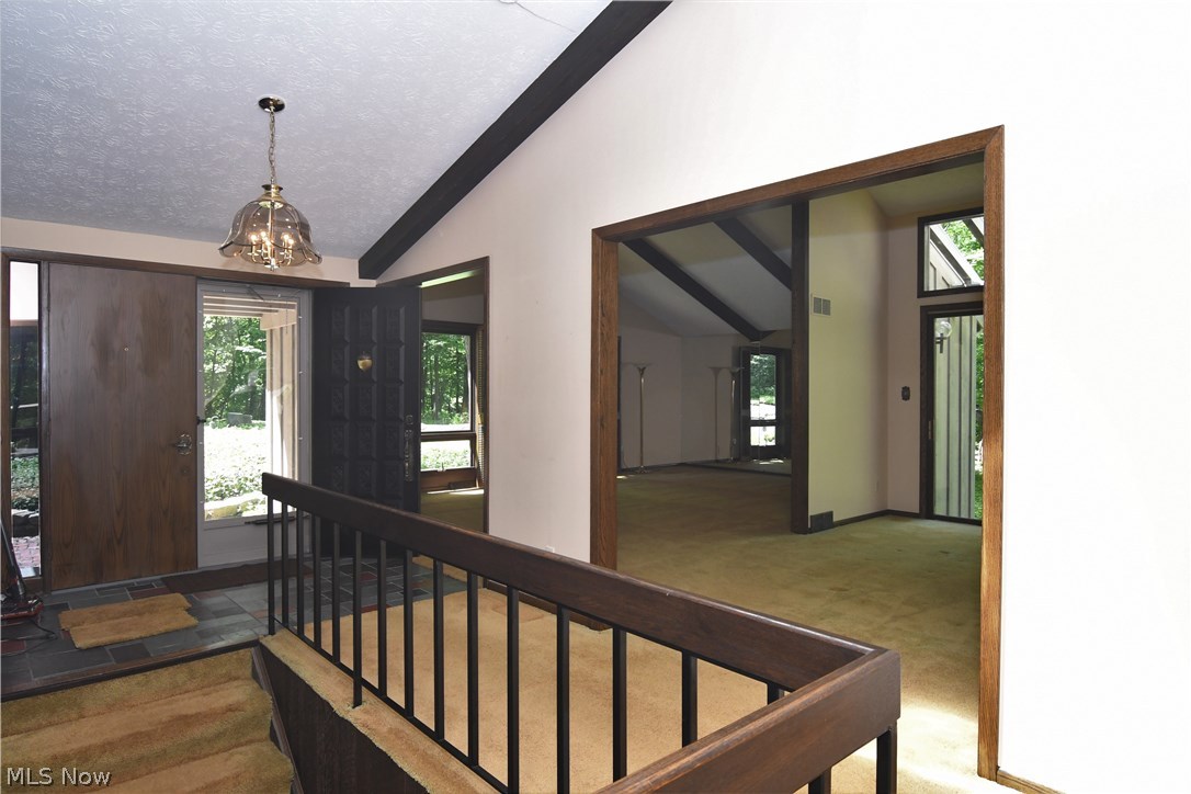 1271 Sand Run Road Akron, OH 44313 - Photo 6 of 32 Foyer entry with double doors, opens to large great room and dining area. wide staircase to lower level