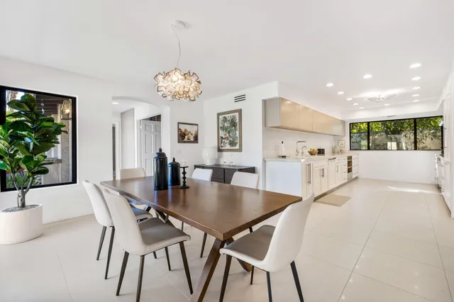 a view of a dining room with furniture and window