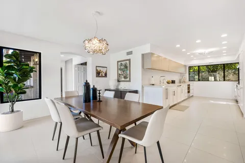 a view of a dining room with furniture and window