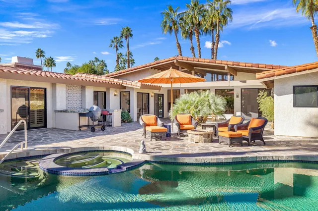 a view of a swimming pool with a patio