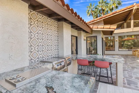 a patio with patio couch and table