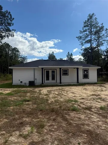 a large tree in front of a house