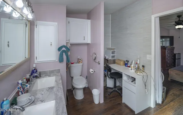 a workspace with furniture and wooden floor