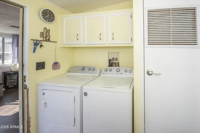 a utility room with dryer and washer