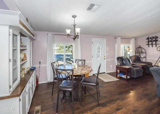 a view of a dining room with furniture window and outside view