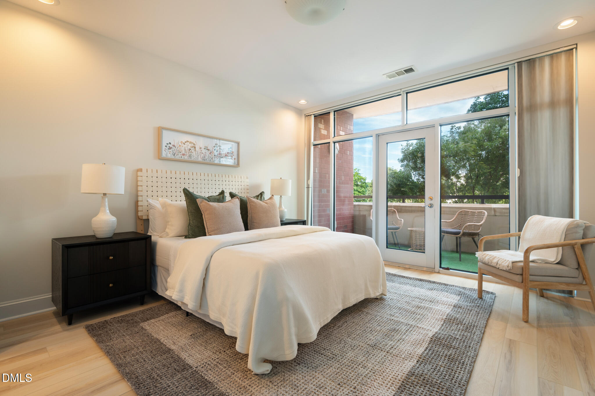 618 North Boylan Avenue, Unit 400 Raleigh, NC 27603 - Photo 13 of 45 a bedroom with bed and a large window