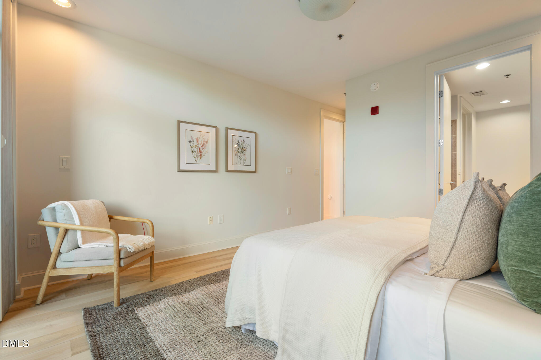 618 North Boylan Avenue, Unit 400 Raleigh, NC 27603 - Photo 15 of 45 a bed room with a bed and chair