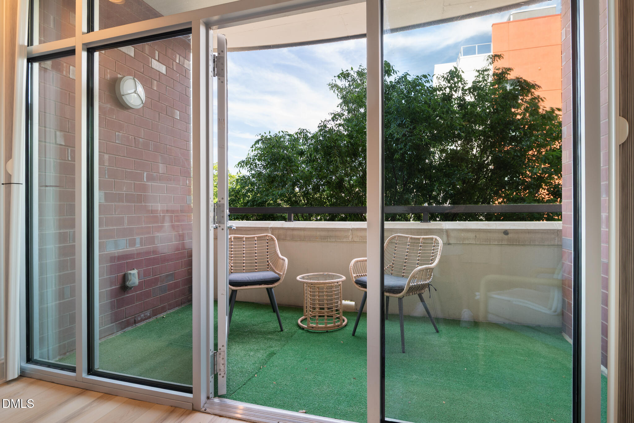618 North Boylan Avenue, Unit 400 Raleigh, NC 27603 - Photo 17 of 45 a balcony with a table and chairs