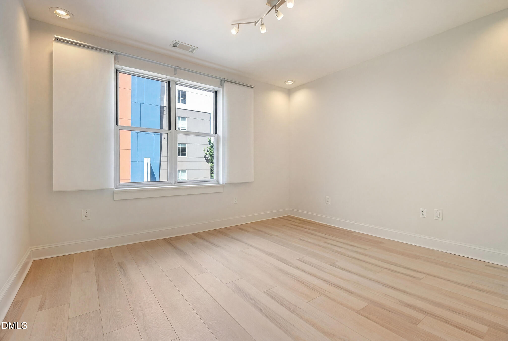 618 North Boylan Avenue, Unit 400 Raleigh, NC 27603 - Photo 23 of 45 wooden floor in an empty room with a window