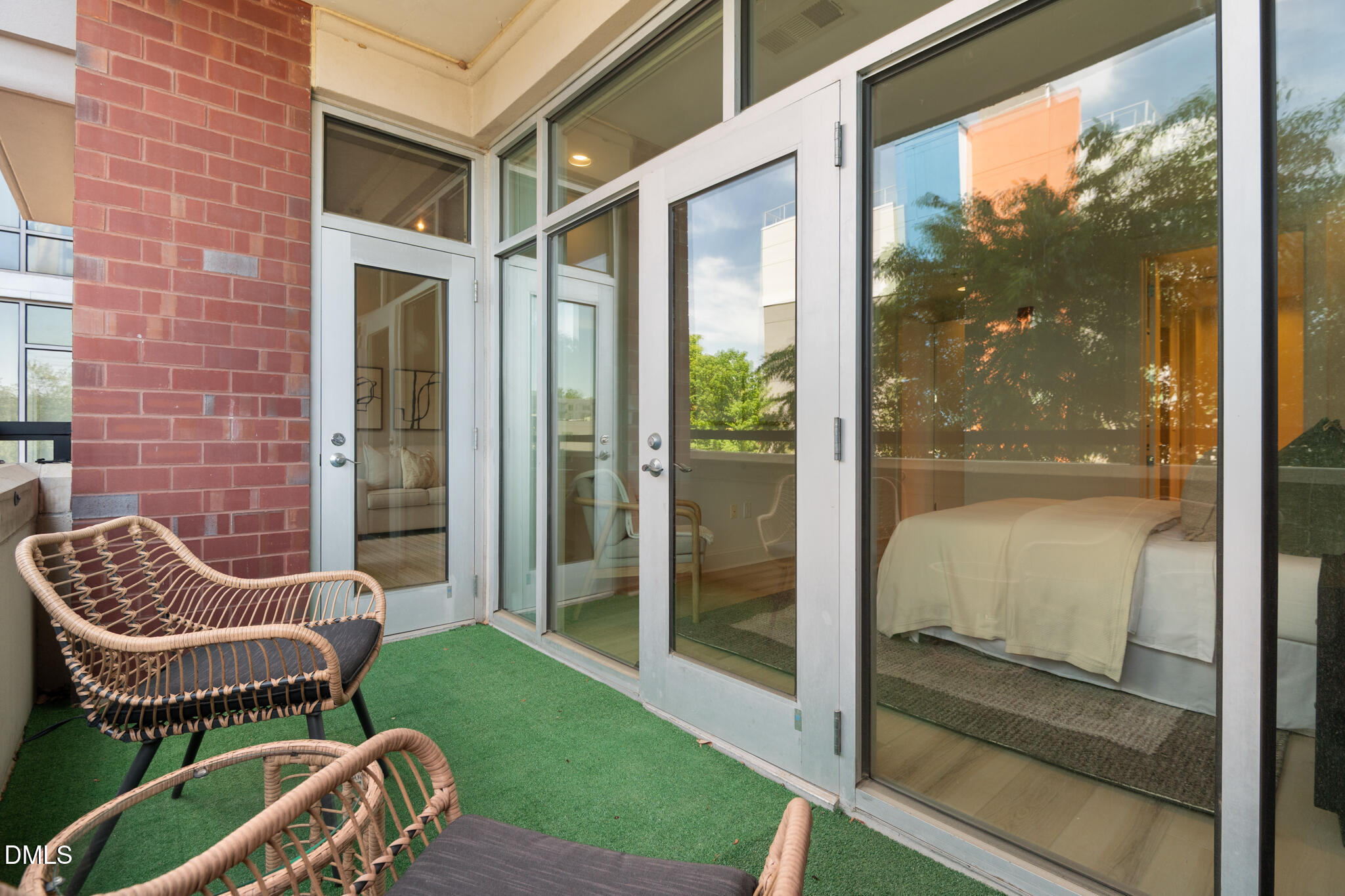 618 North Boylan Avenue, Unit 400 Raleigh, NC 27603 - Photo 26 of 45 a balcony with a couch and a swing chair