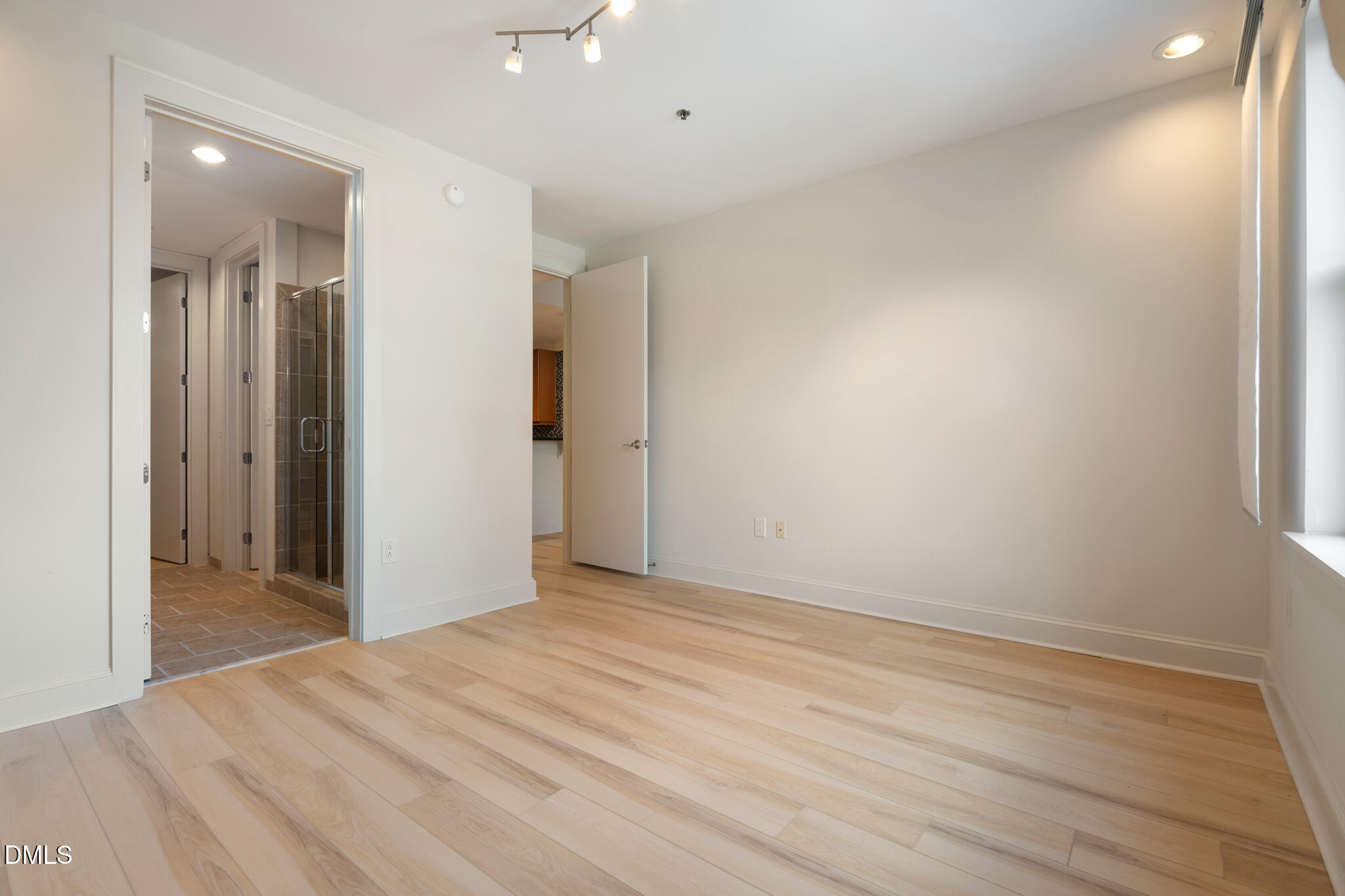 618 North Boylan Avenue, Unit 400 Raleigh, NC 27603 - Photo 27 of 45 an empty room with wooden floor and windows