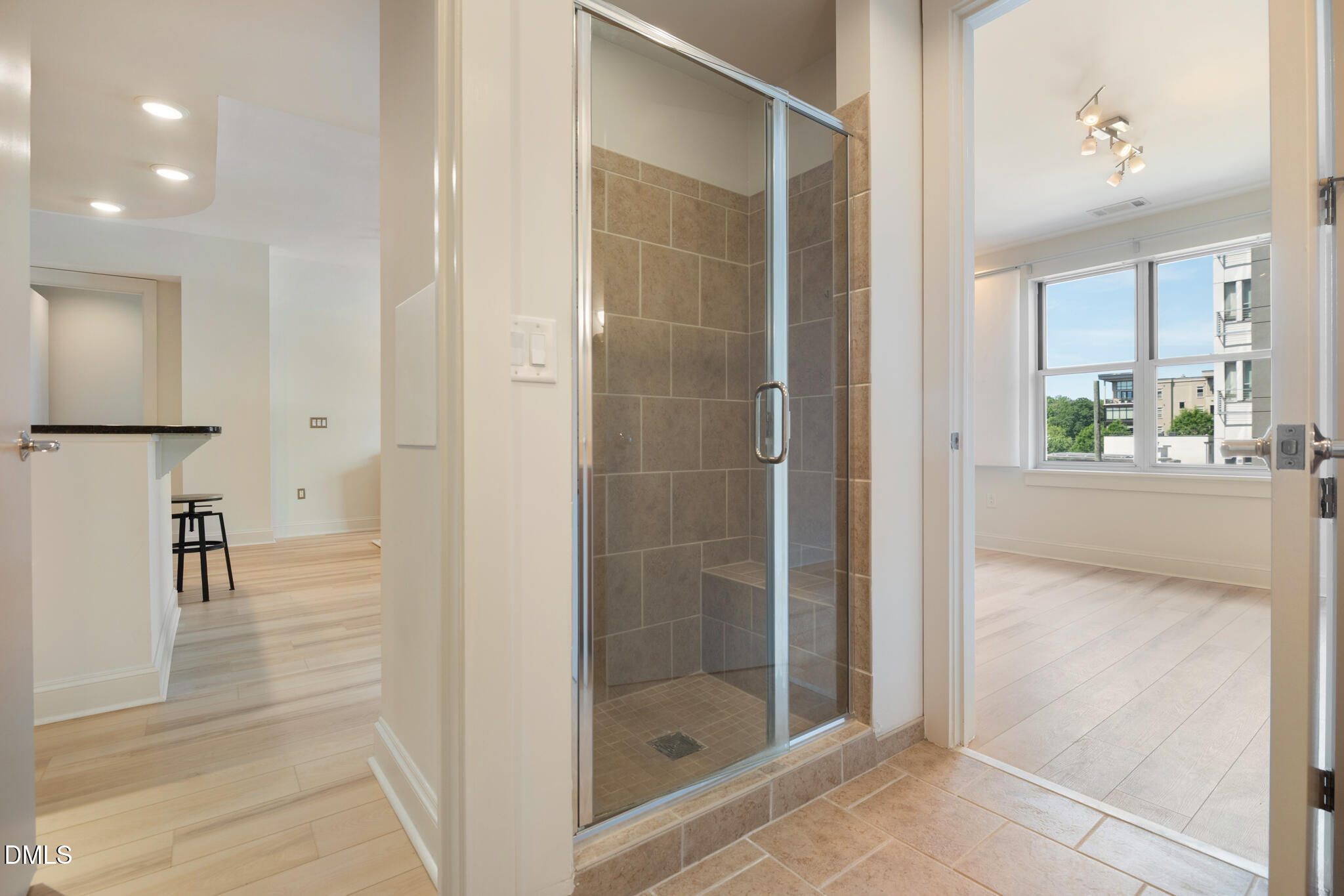 618 North Boylan Avenue, Unit 400 Raleigh, NC 27603 - Photo 28 of 45 a bathroom with a shower and a glass door