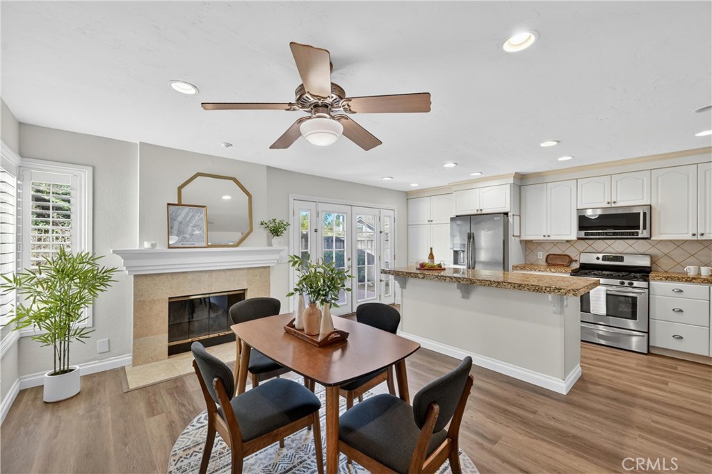 11562 Chadwick Road Corona, CA 92878 - Photo 10 of 39 Informal dining and fireplace