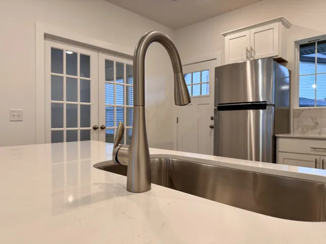 a view of a living room and entryway