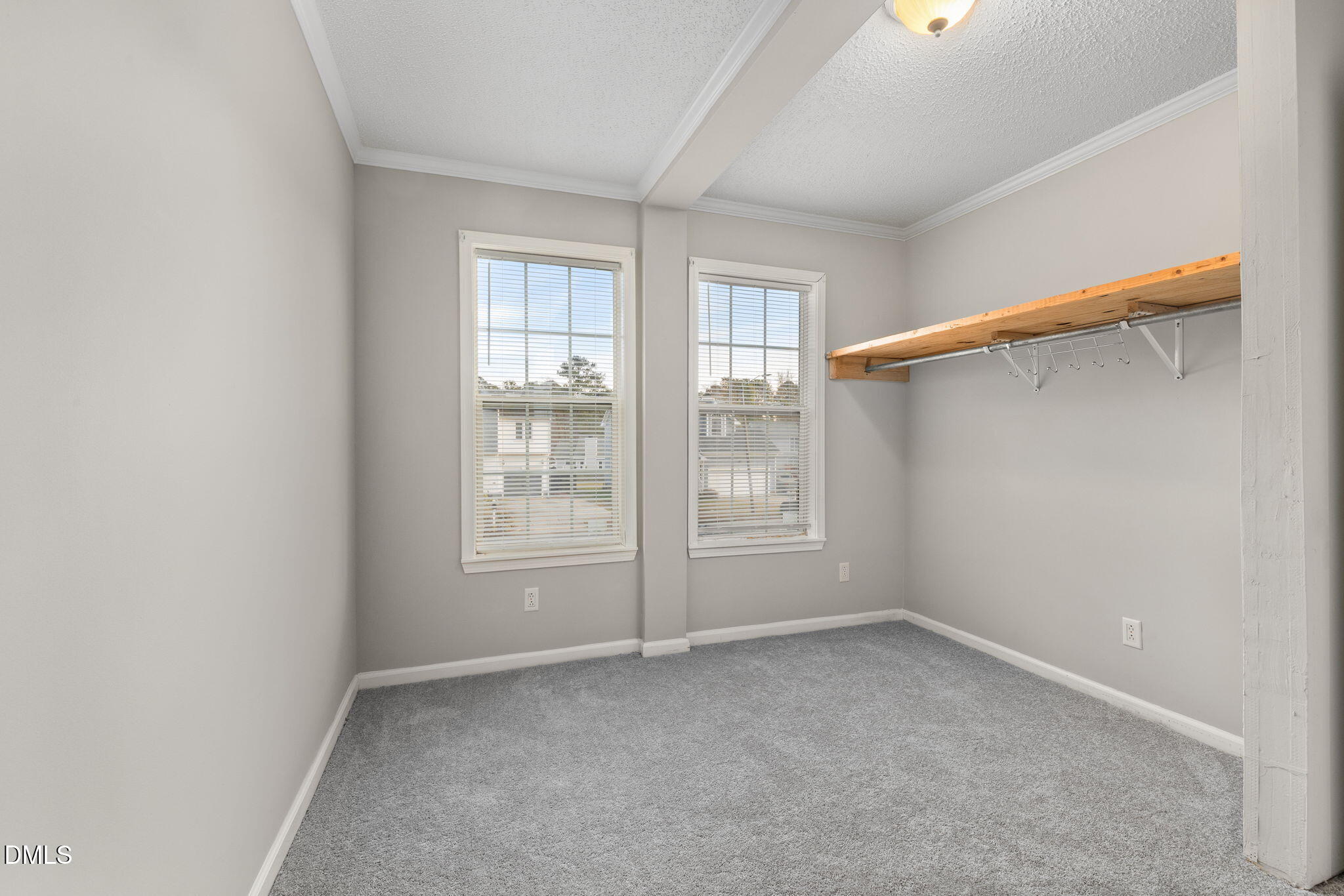 2850 Sanderford Road Raleigh, NC 27610 - Photo 25 of 34 an empty room with windows and closet