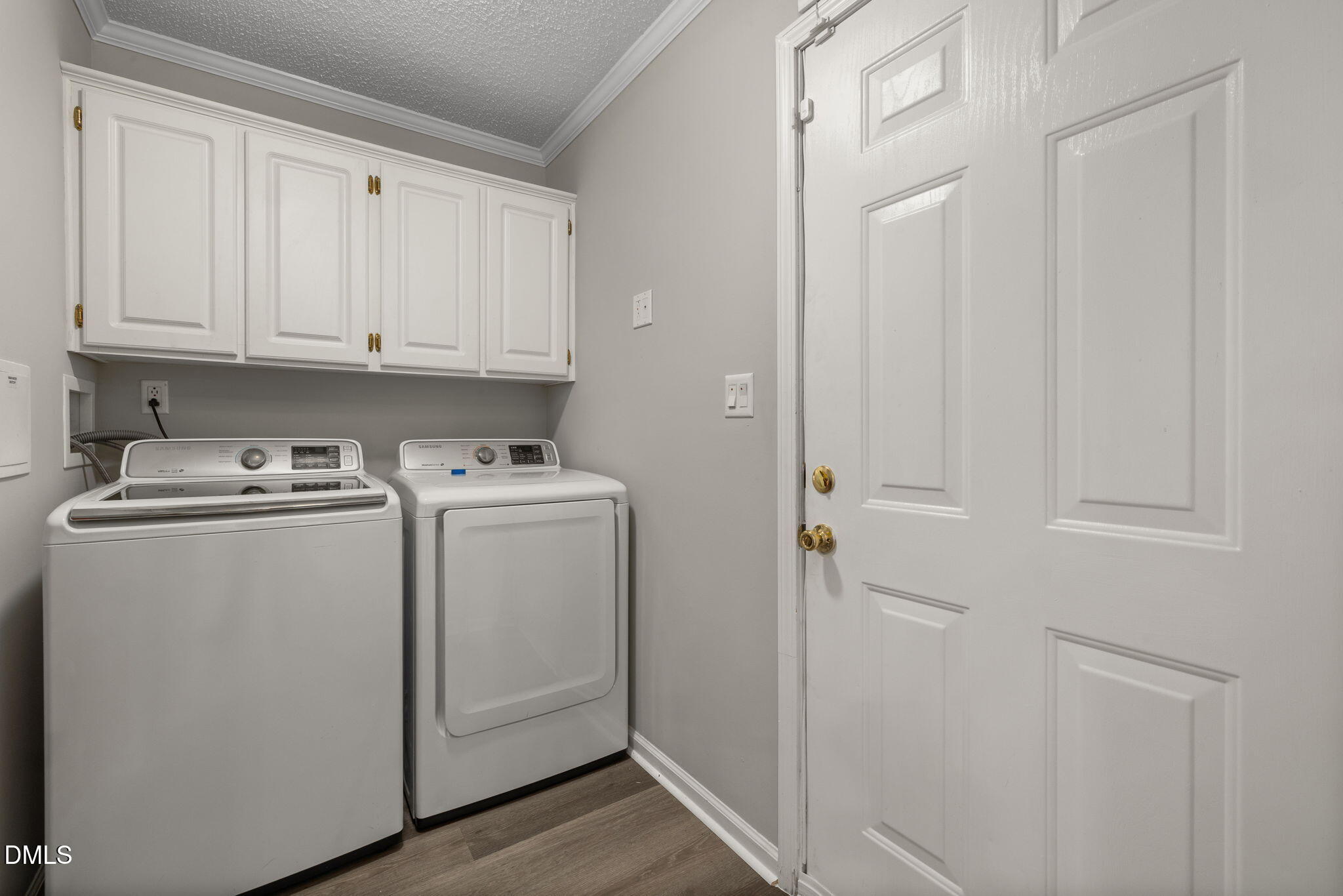 2850 Sanderford Road Raleigh, NC 27610 - Photo 30 of 34 a view of cabinets and washer dryer