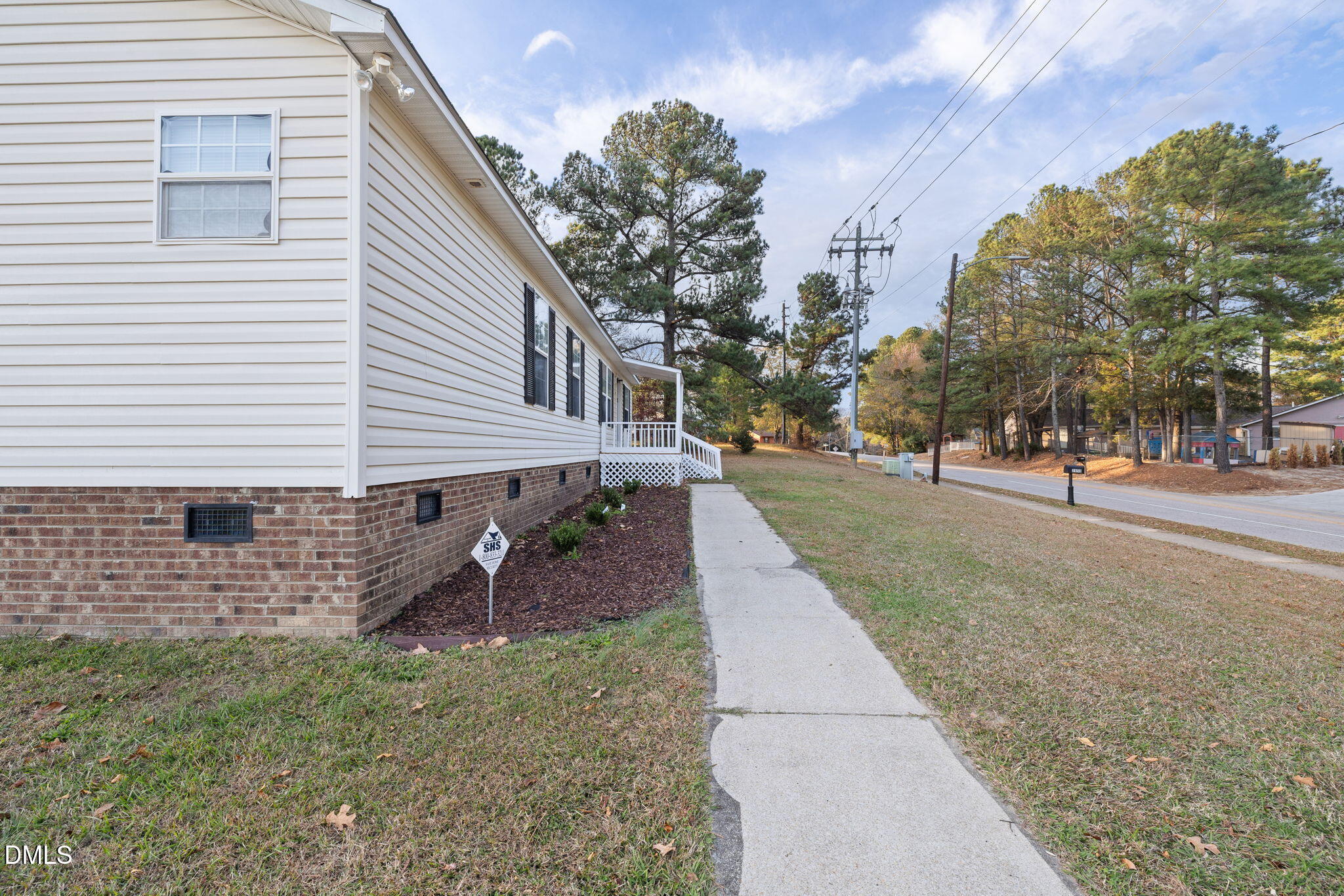 2850 Sanderford Road Raleigh, NC 27610 - Photo 3 of 34 a front view of a house with a yard