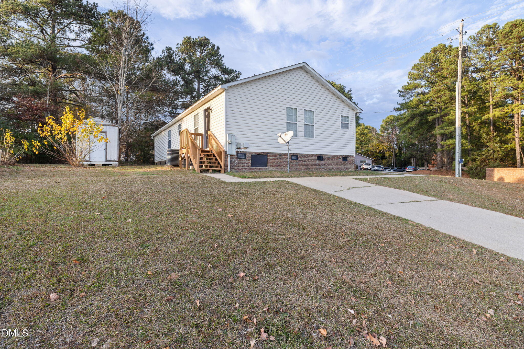2850 Sanderford Road Raleigh, NC 27610 - Photo 31 of 34 a view of a house with a yard and garage