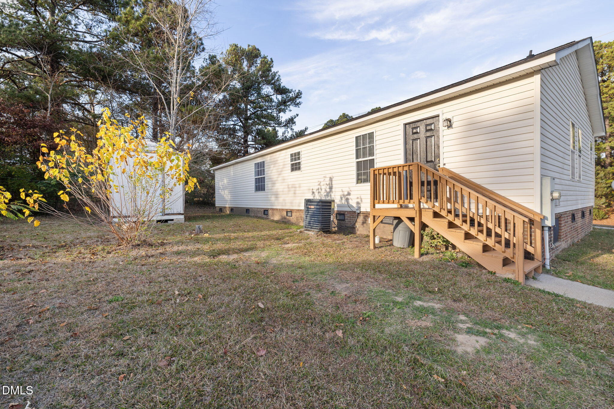 2850 Sanderford Road Raleigh, NC 27610 - Photo 33 of 34 a view of a house with a yard