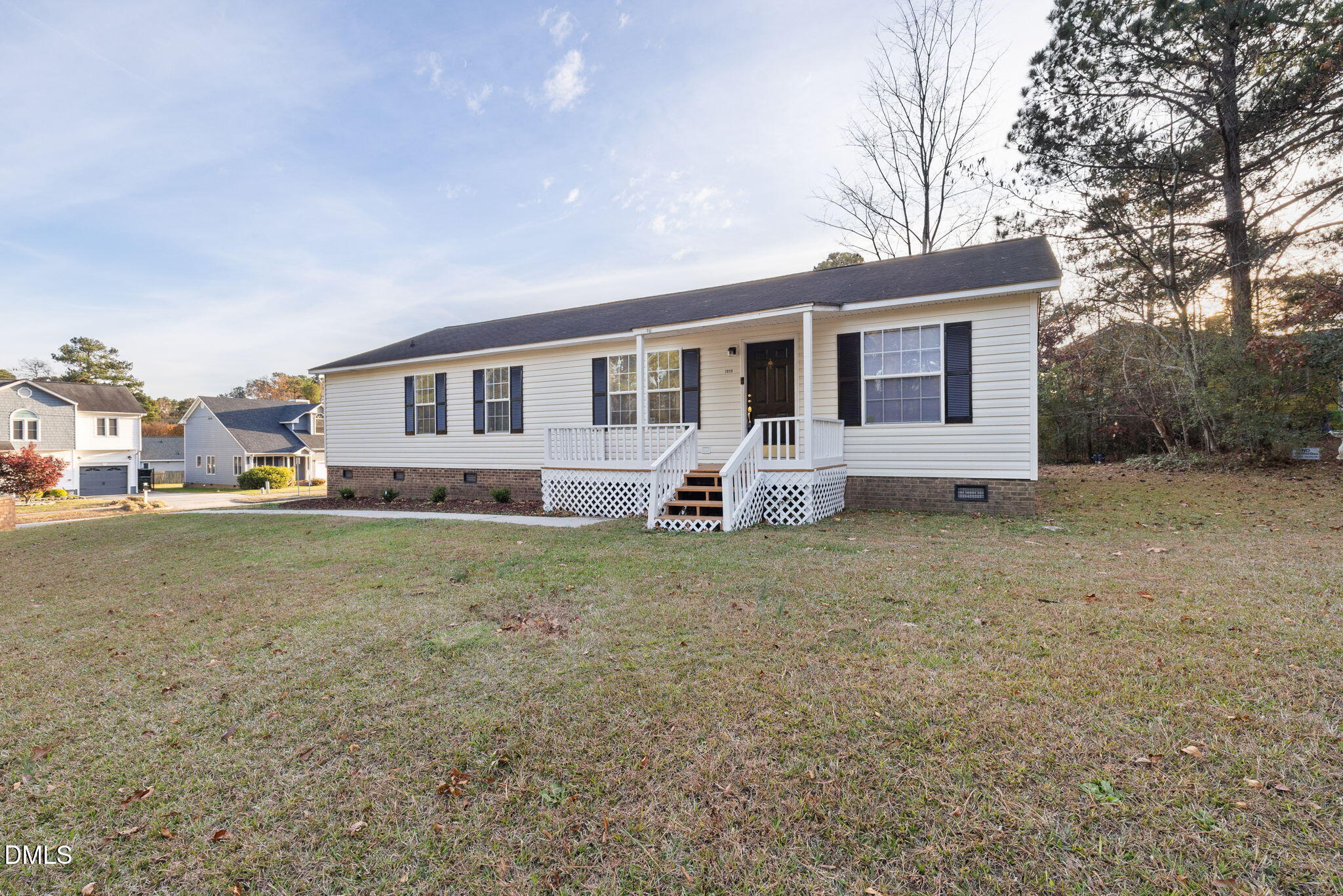 2850 Sanderford Road Raleigh, NC 27610 - Photo 4 of 34 a front view of house with yard and trees in the background
