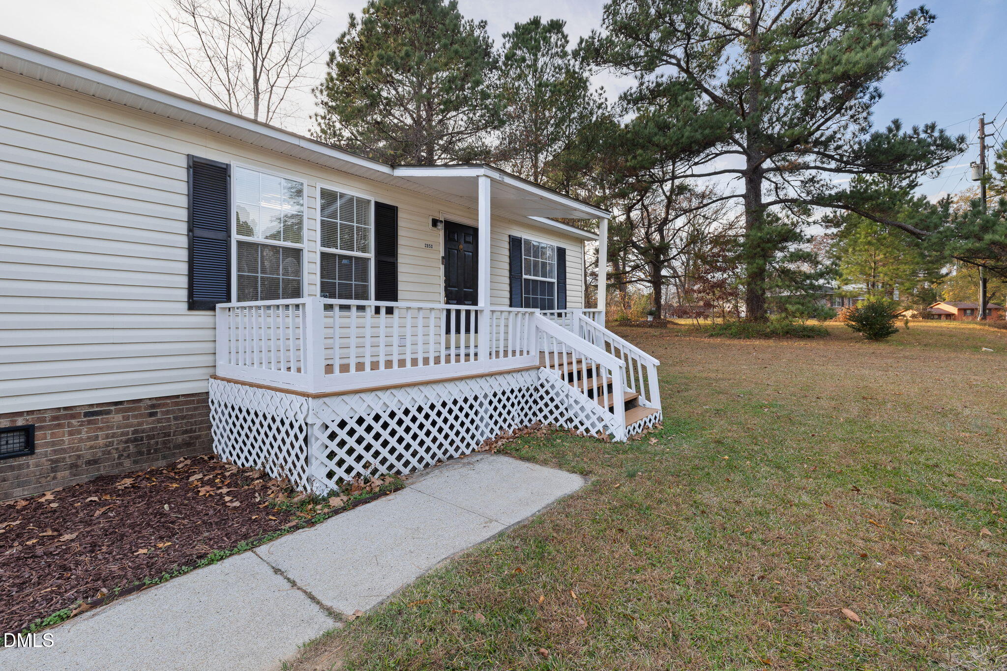 2850 Sanderford Road Raleigh, NC 27610 - Photo 5 of 34 a view of a house with a yard
