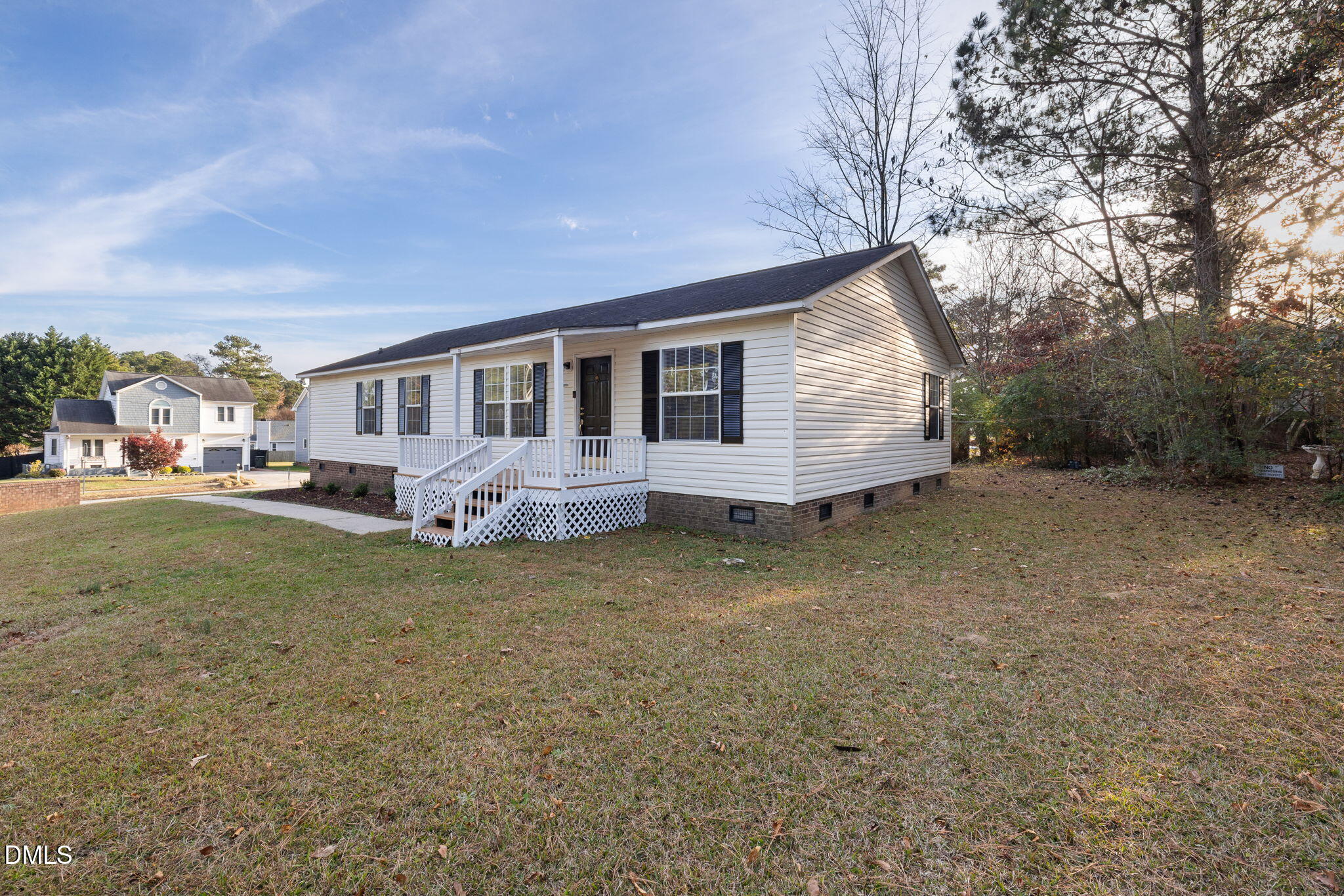 2850 Sanderford Road Raleigh, NC 27610 - Photo 6 of 34 a view of a house with a backyard