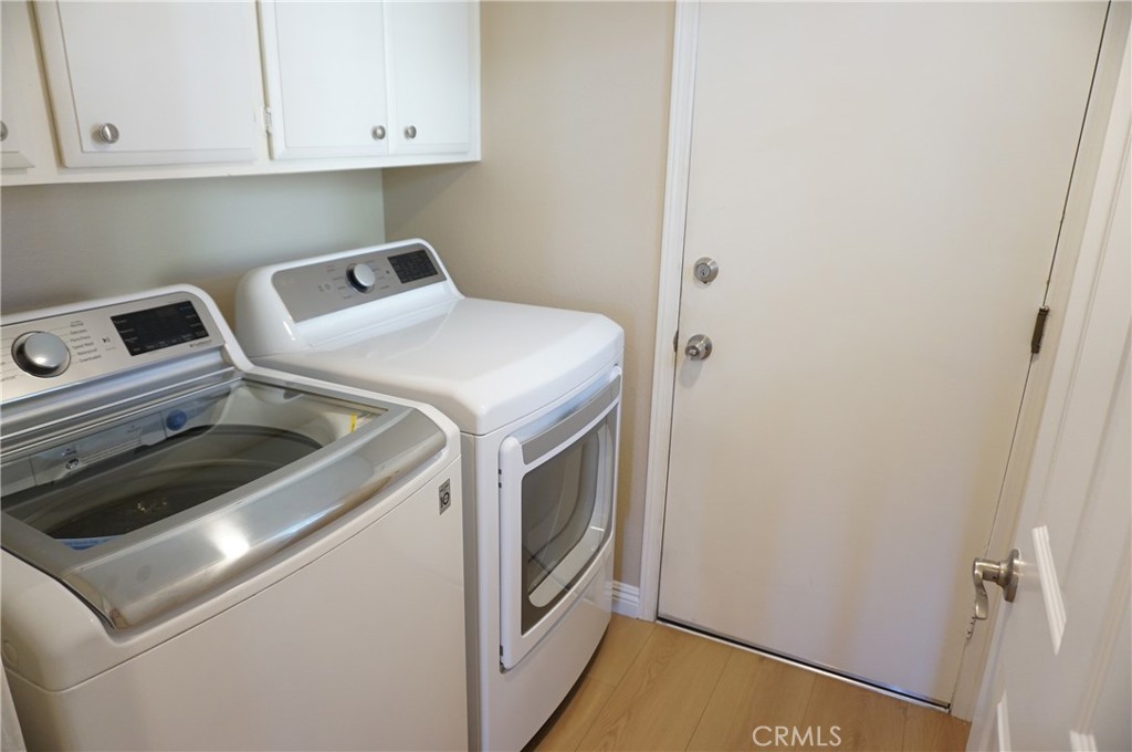 19584 Shadow Glen Circle Porter Ranch, CA 91326 - Photo 18 of 72 a utility room with dryer and washer