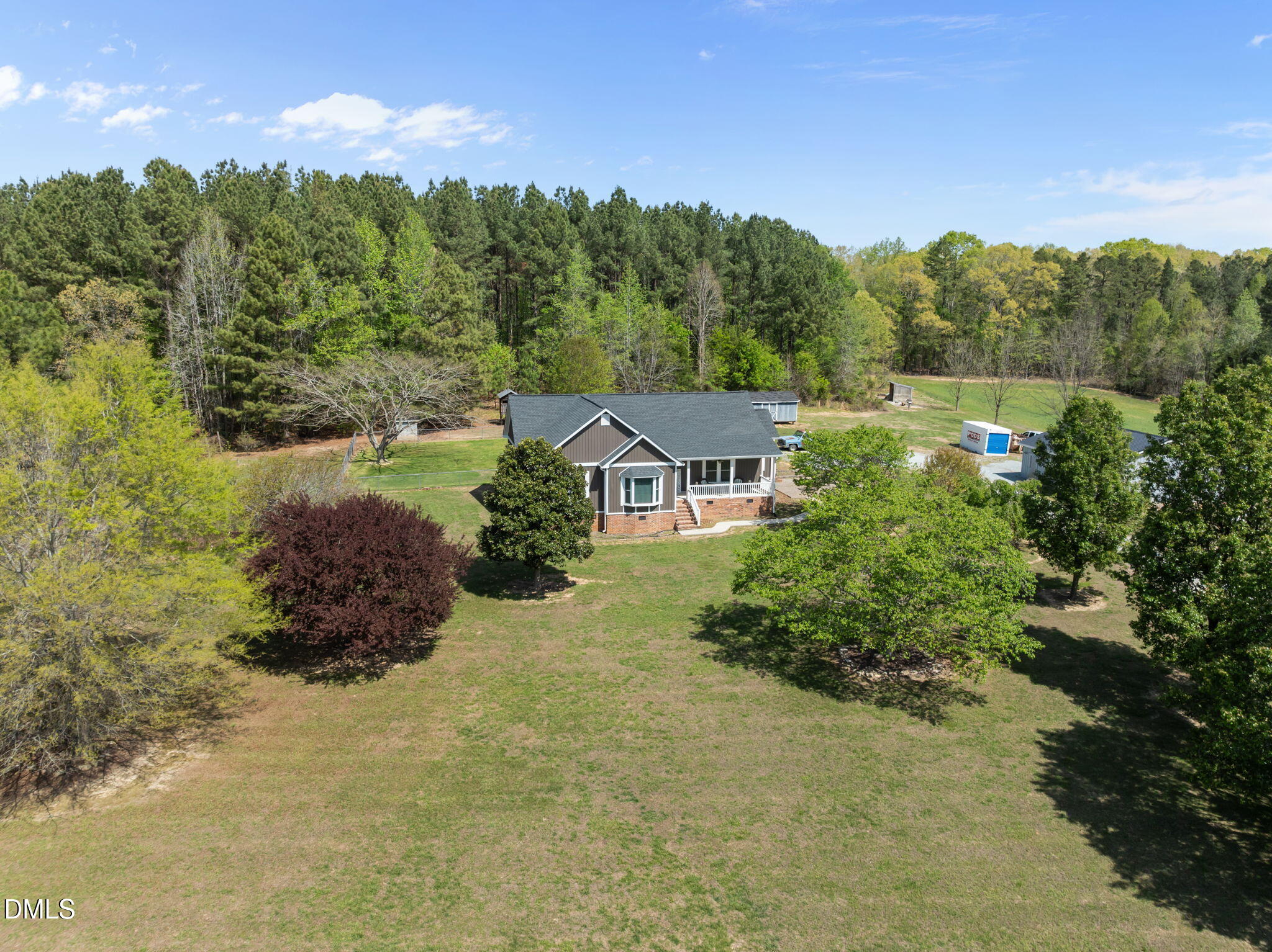 236 Dirgie Mine Road Roxboro, NC 27574 - Photo 55 of 55 a view of a house with a yard and a forest