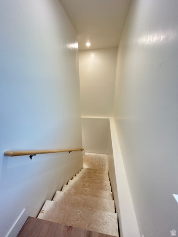 6 South 450th West Gunnison, UT 84634 - Photo 37 of 45 Stairwell with light wood-finish flooring at the landing, a natural wood handrail, recessed lighting, and light-toned walls