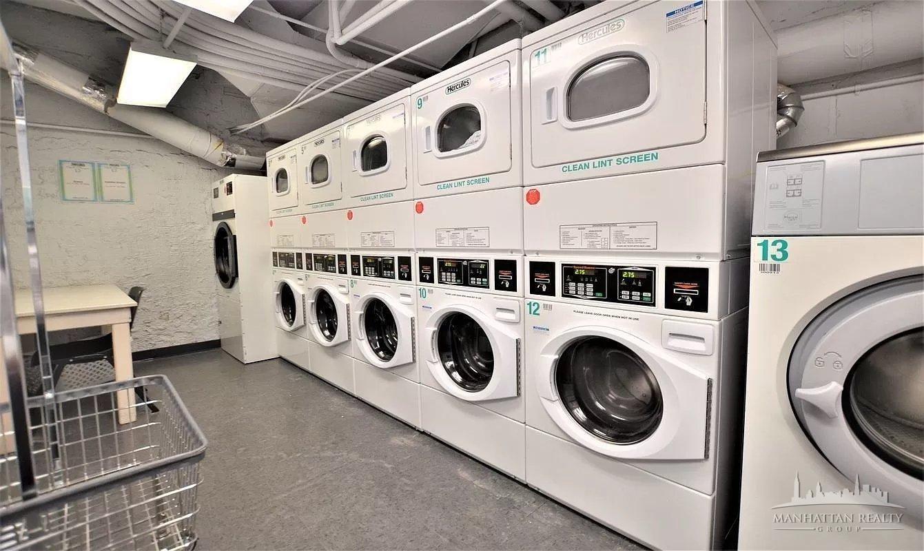 108 East 38th Street, Unit 310 Manhattan, NY 10016 - Photo 5 of 6 a utility room with dryer and washer