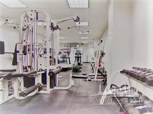 108 East 38th Street, Unit 310 Manhattan, NY 10016 - Photo 6 of 6 a view of a room with gym equipment