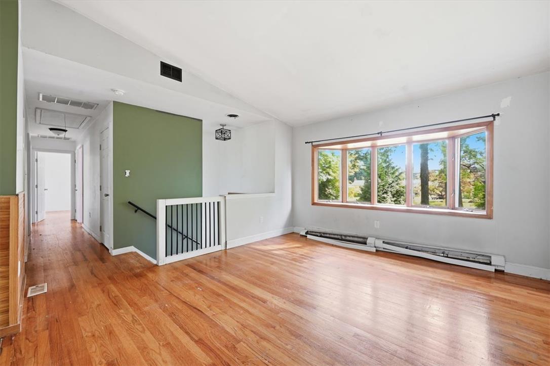 9870 North Delaware Drive Bangor, PA 18013 - Photo 10 of 62 Gleaming hardwood floors and a generous bay window define this open living area.