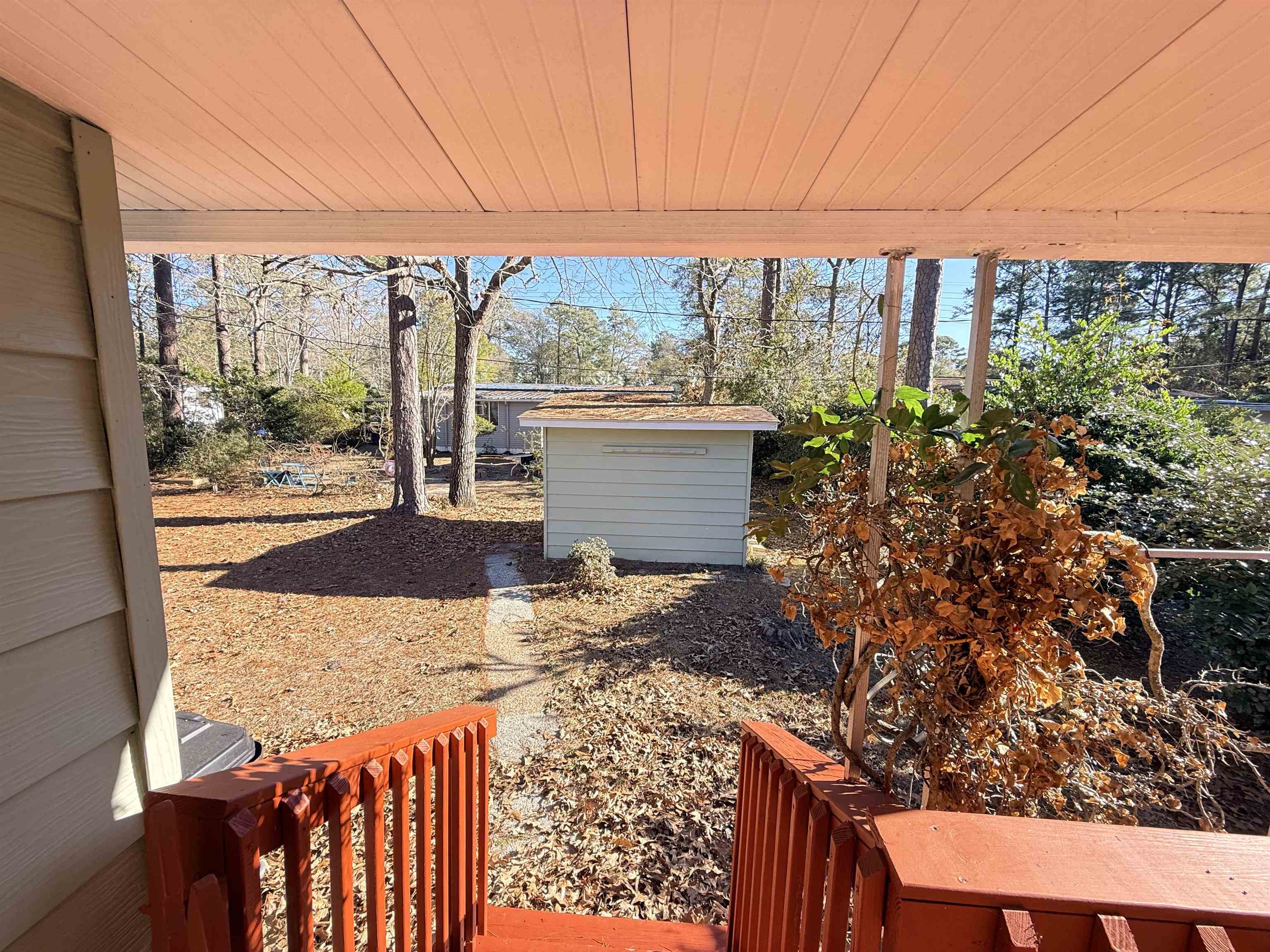 3043 Atlanta Circle Murrells Inlet, SC 29576 - Photo 28 of 36 View of yard with a wooden deck and an outdoor structure