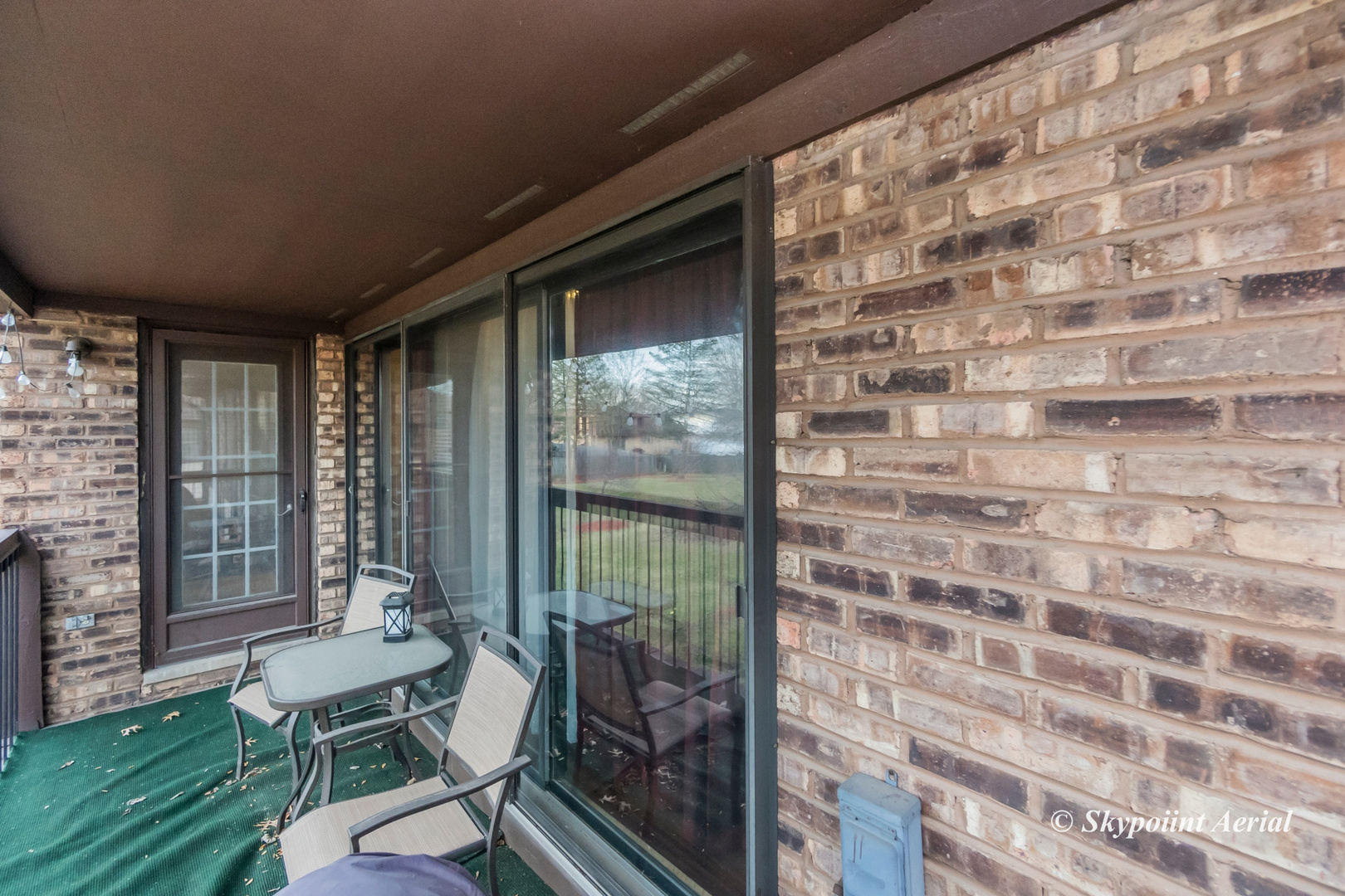 3231 West 184th Street, Unit 2B Homewood, IL 60430 - Photo 15 of 22 a balcony with chairs and with an outdoor view