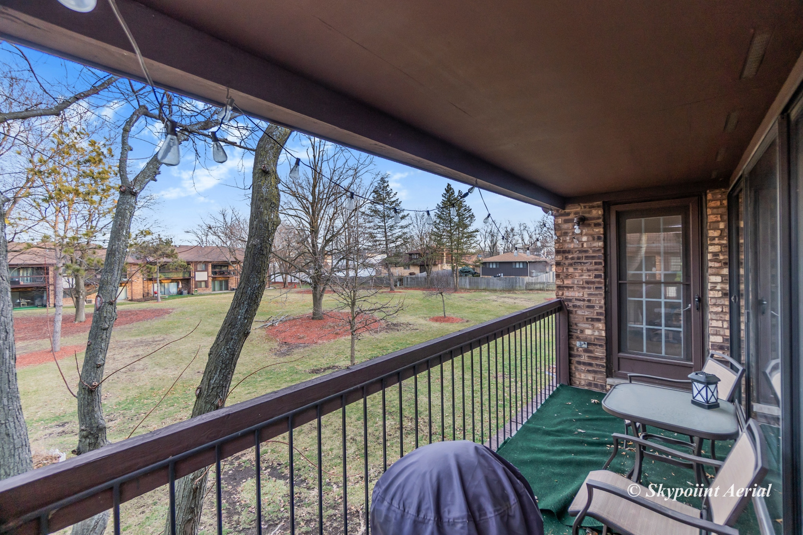 3231 West 184th Street, Unit 2B Homewood, IL 60430 - Photo 16 of 22 a view of a porch with wooden floor and furniture