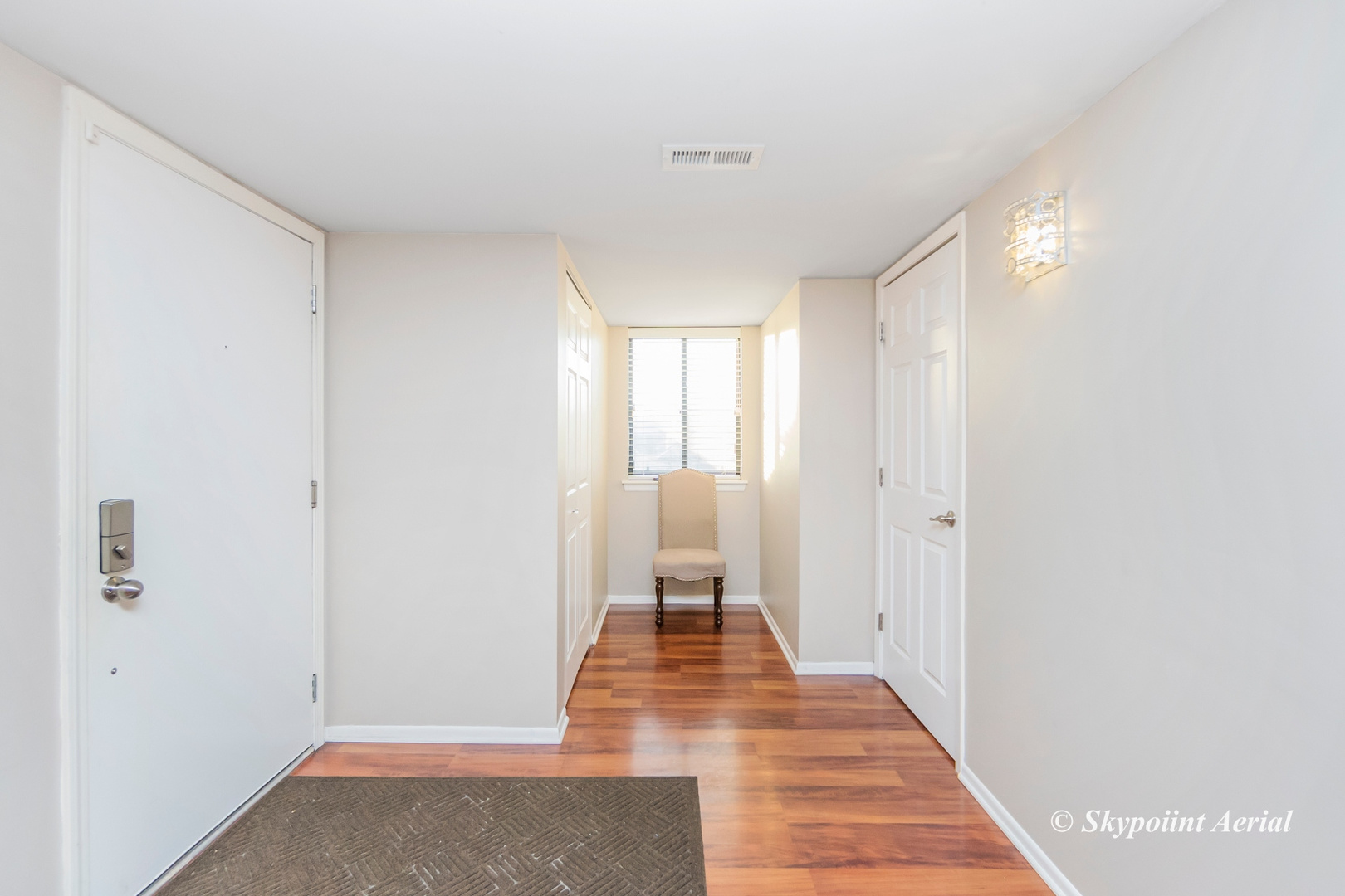 3231 West 184th Street, Unit 2B Homewood, IL 60430 - Photo 8 of 22 a view of a room with wooden floor and a window