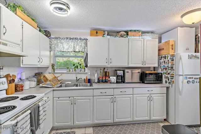 a view of a dining room with furniture and a window