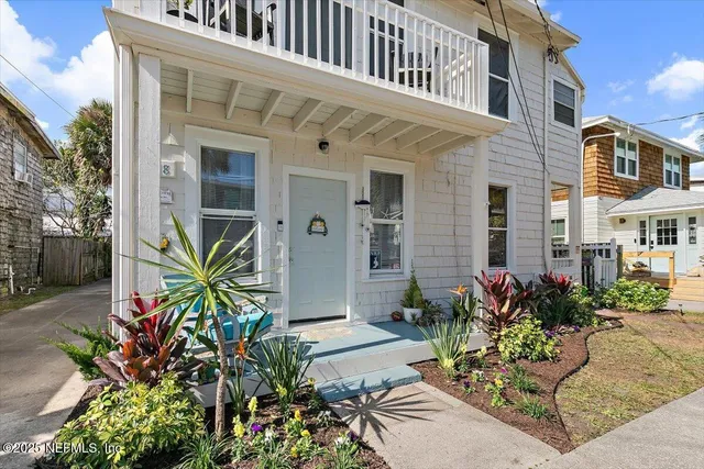 a view of a building with potted plants