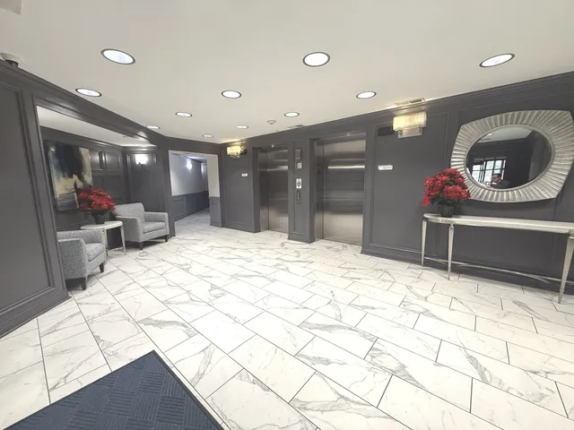 a bathroom with a sink mirror and vanity