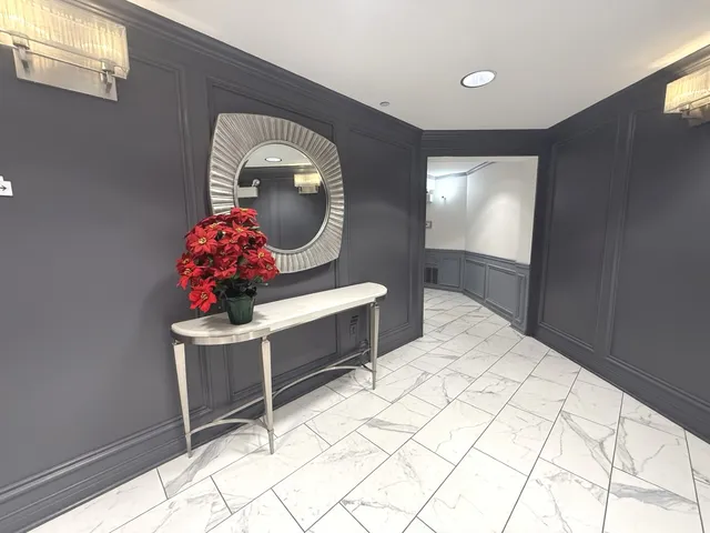 a bed room with a bed and a chair