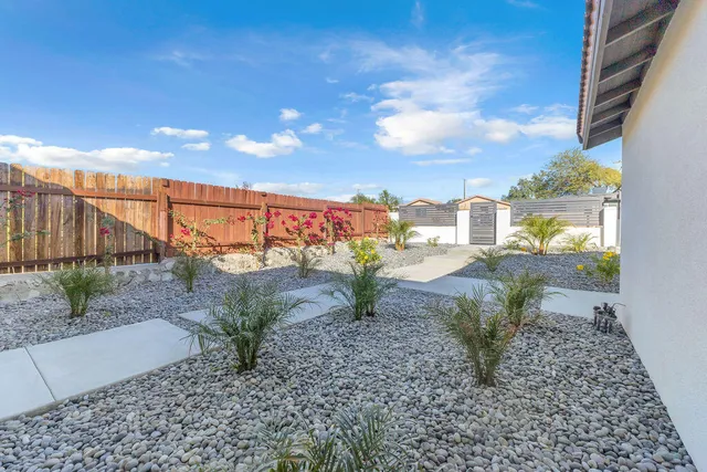 a view of a yard and patio