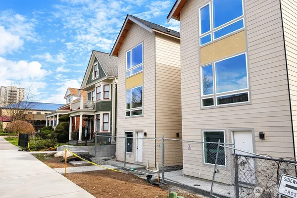 a front view of a house with garage