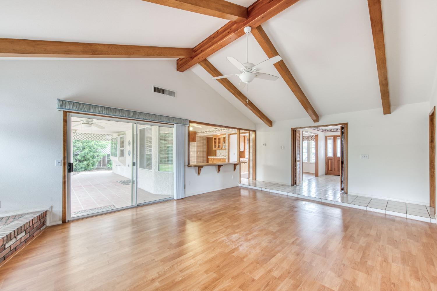 2530 Sterling Avenue Sanger, CA 93657 - Photo 20 of 40 a view of an empty room with wooden floor and a window