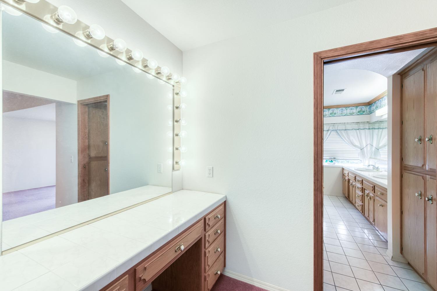 2530 Sterling Avenue Sanger, CA 93657 - Photo 33 of 40 a bathroom with a sink and a mirror