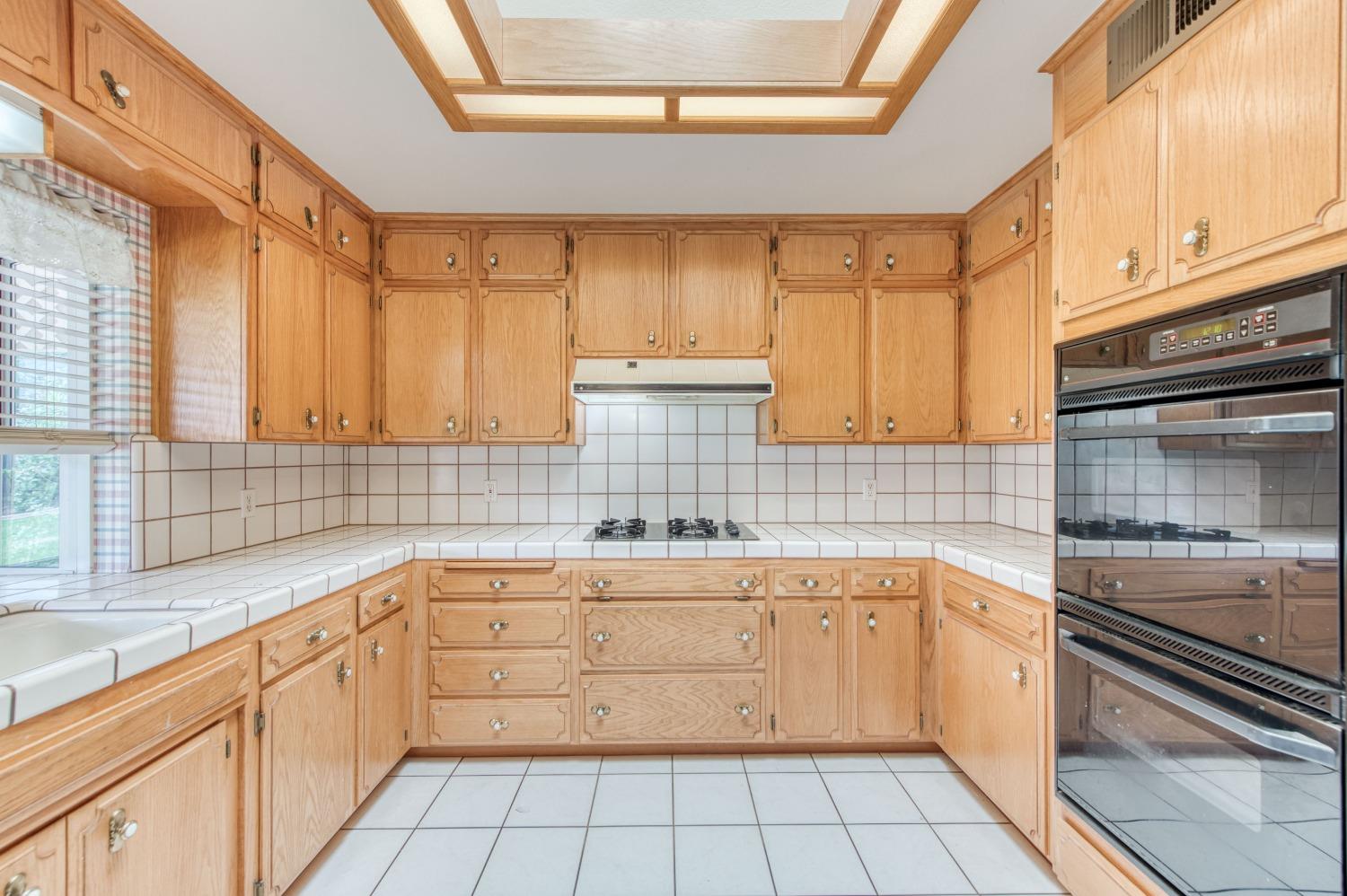 2530 Sterling Avenue Sanger, CA 93657 - Photo 8 of 40 a kitchen with a sink stove and cabinets
