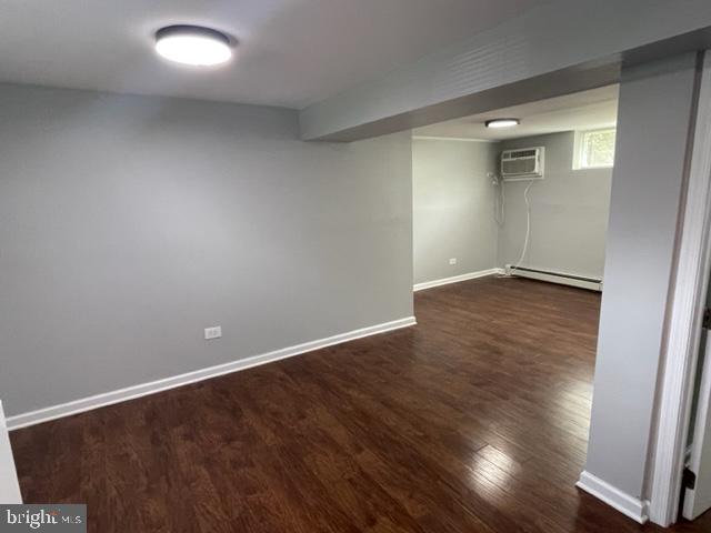 2032 Maple Avenue, Unit 9 Haddon Heights, NJ 08035 - Photo 6 of 8 an empty room with wooden floor and windows