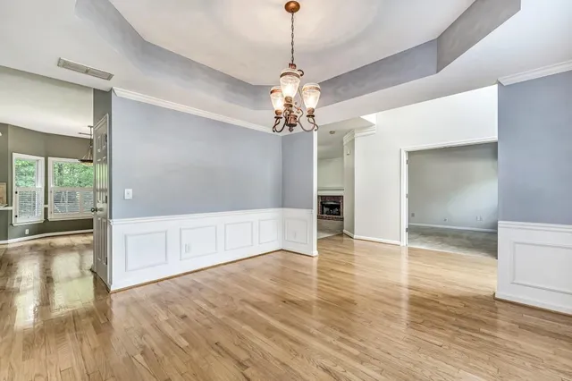a view of a livingroom with wooden floor