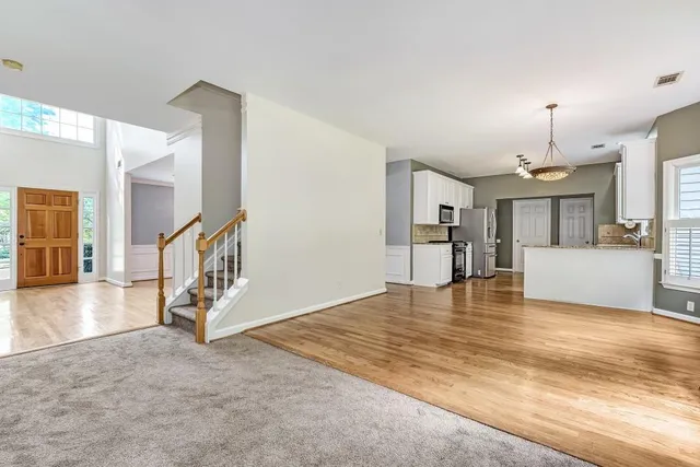 a view of a livingroom with a kitchen